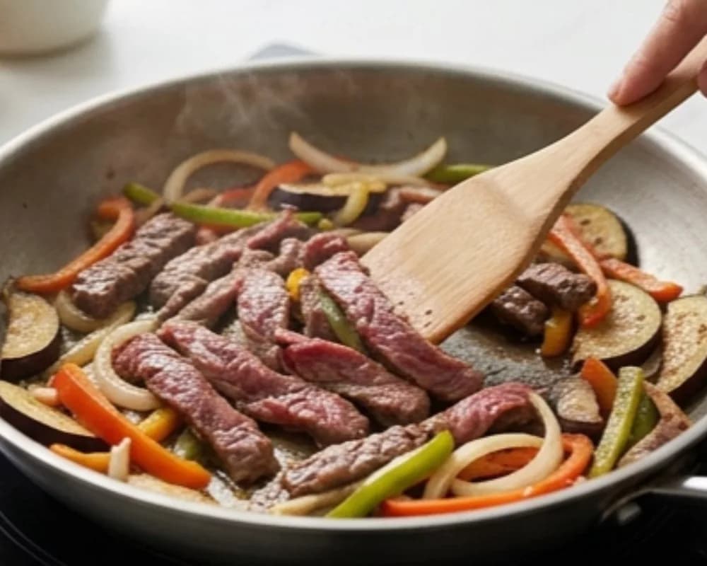 Stir-fry the beef and vegetables