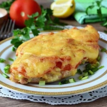 Chicken breast under a cheese and mushroom coat