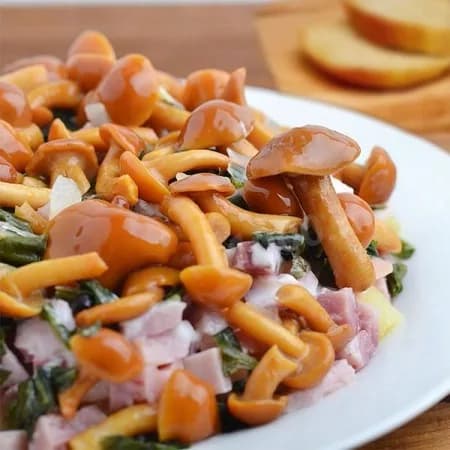 Salad with ham and pickled mushrooms