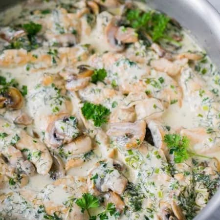 Chicken fillet with mushrooms in a creamy cheese sauce