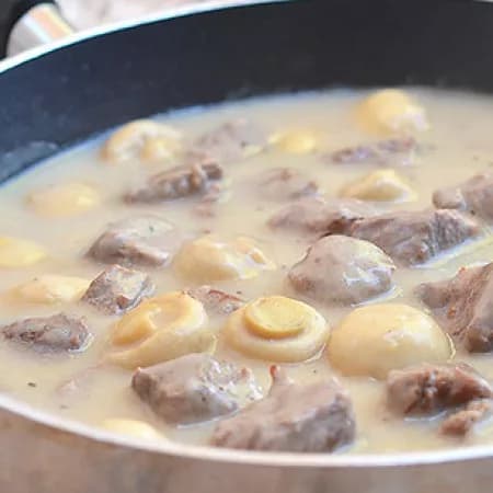 Beef with mushrooms in wine and sour cream sauce