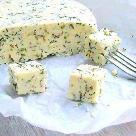 Homemade cheese with herbs and caraway seeds